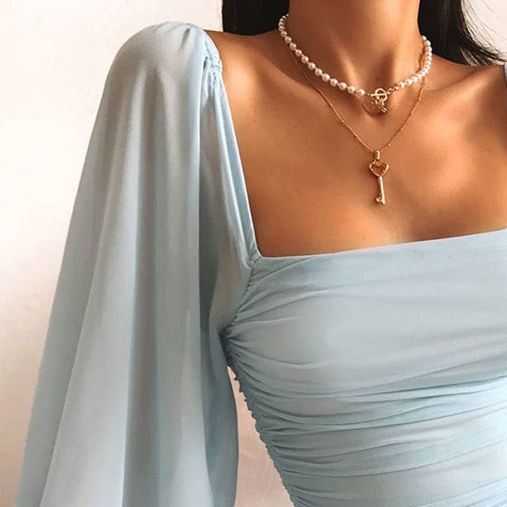 Virelle | Jasnoniebieska sukienka mini bodycon z bufiastymi rękawami